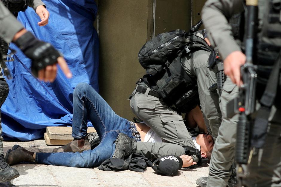 Israeli police clash with Palestinians at the compound that houses Al-Aqsa Mosque in Jerusalem