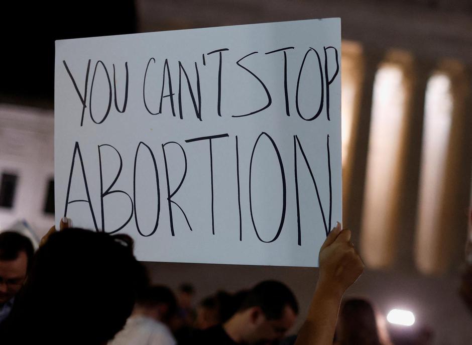 Protesters react outside the U.S. Supreme Court after the leak of a draft opinion preparing for a majority of the court to overturn the Roe v. Wade abortion rights decision in Washington