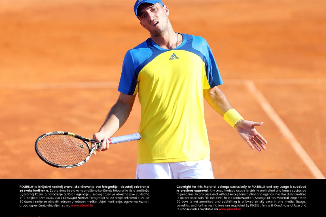 '23.07.2013., Umag - Prvo kolo 24. Vegeta Croatia Open teniskog turnira u Umagu. Antonio Veic (CRO) - Viktor Troicki (SRB). Photo: Slavko Midzor/PIXSELL'