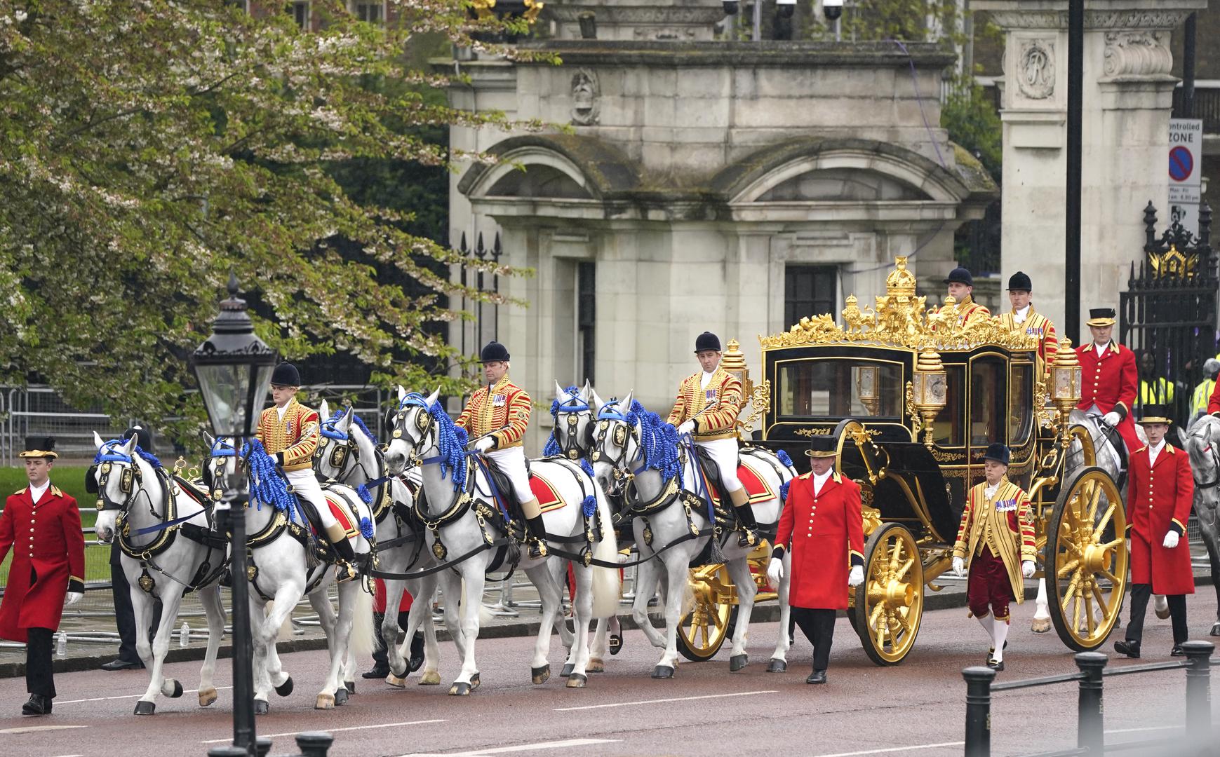 The Diamond Jubilee State Coach is accompanied by the Sovereign's Escort of the Household Cavalry as it arrives at Buckingham Palace ahead of the coronation ceremony of King Charles III and Queen Camilla in central London. Picture date: Saturday May 6, 2023. Photo: Owen Humphreys/PRESS ASSOCIATION