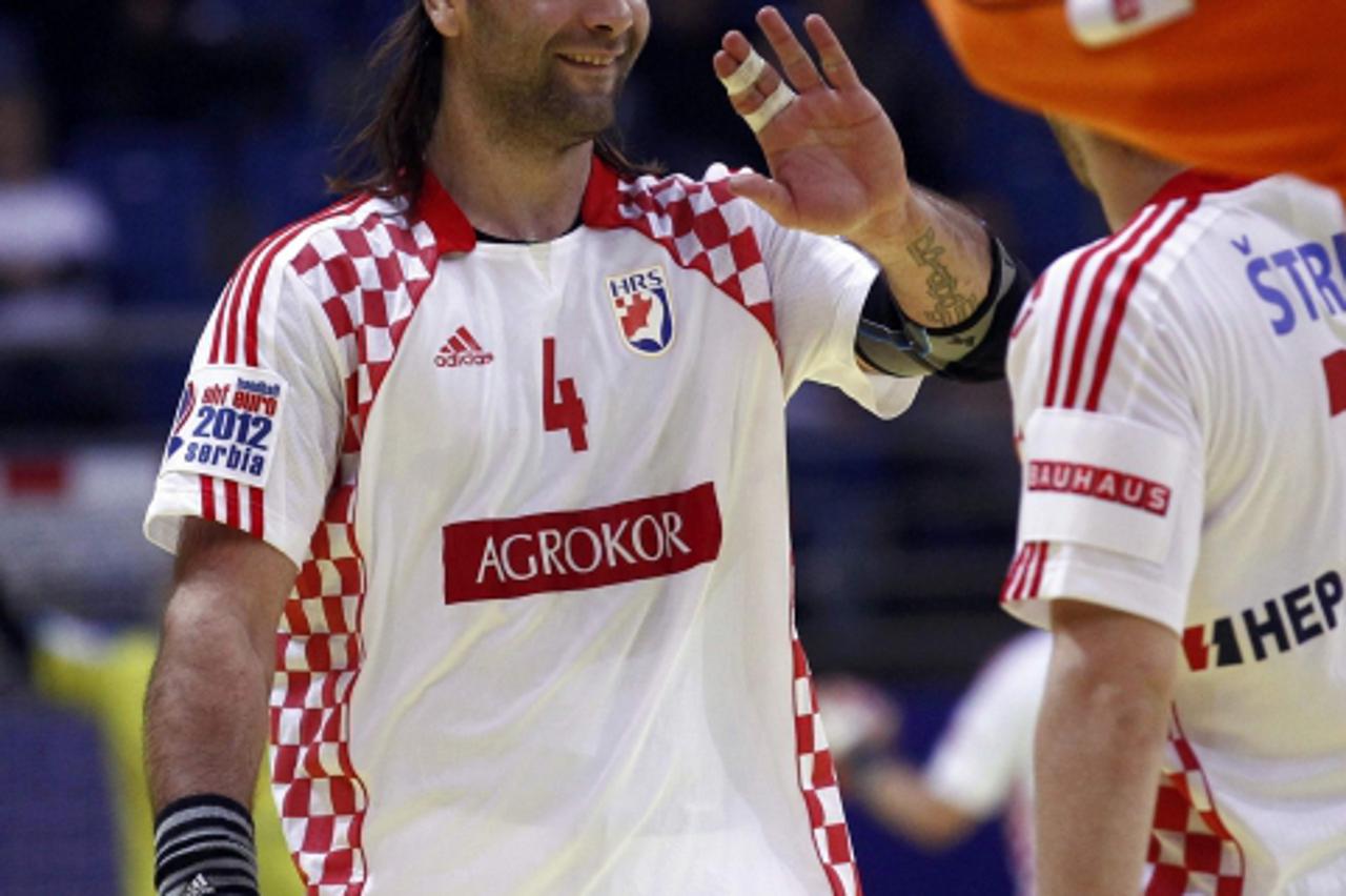 'Croatia\'s Ivano Balic celebrates his team\'s victory over Iceland after their Men\'s European Handball Championship Group D match in Vrsac January 16, 2012.    REUTERS/Ivan Milutinovic (SERBIA  - Ta