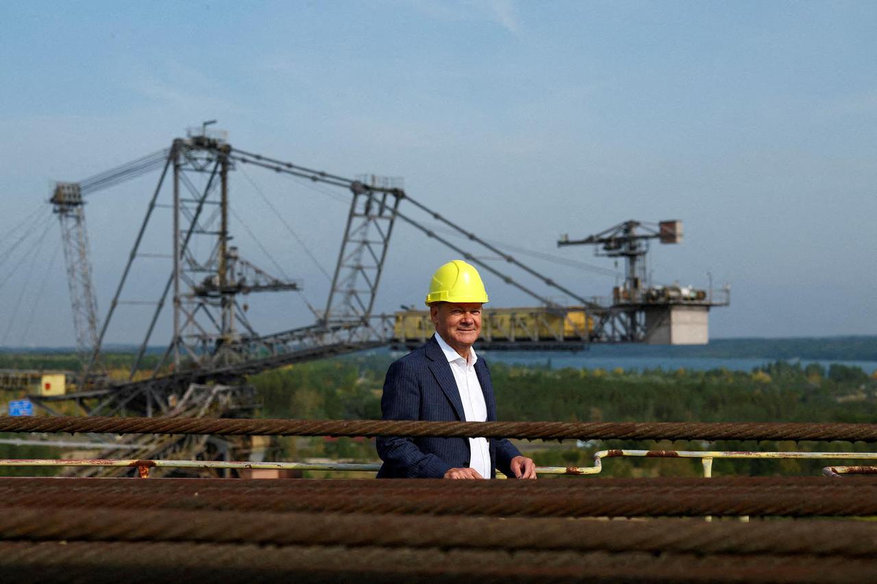 FILE PHOTO: German Chancellor Scholz and Petra Koepping of SPD visit an old lignite excavator at the Mining Technology Park and the recultivation of lignite mining in Grosspoesna