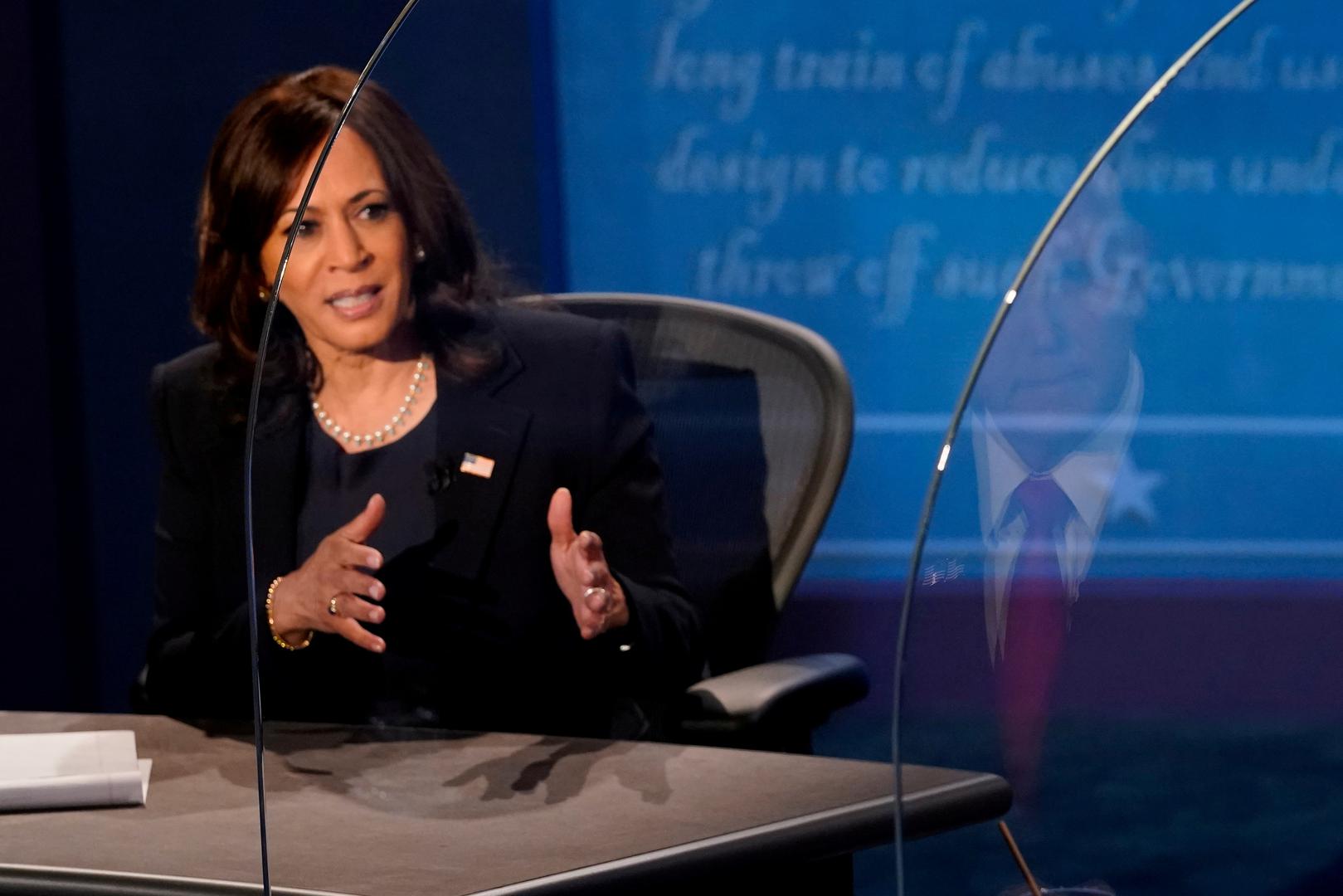 U.S. 2020 vice presidential debate Democratic vice presidential nominee and U.S. Senator Kamala Harris speaks during the 2020 vice presidential debate with U.S. Vice President Mike Pence (reflected on plexiglass barrier on right), on the campus of the University of Utah in Salt Lake City, Utah, U.S., October 7, 2020.  Morry Gash/Pool via REUTERS     TPX IMAGES OF THE DAY POOL