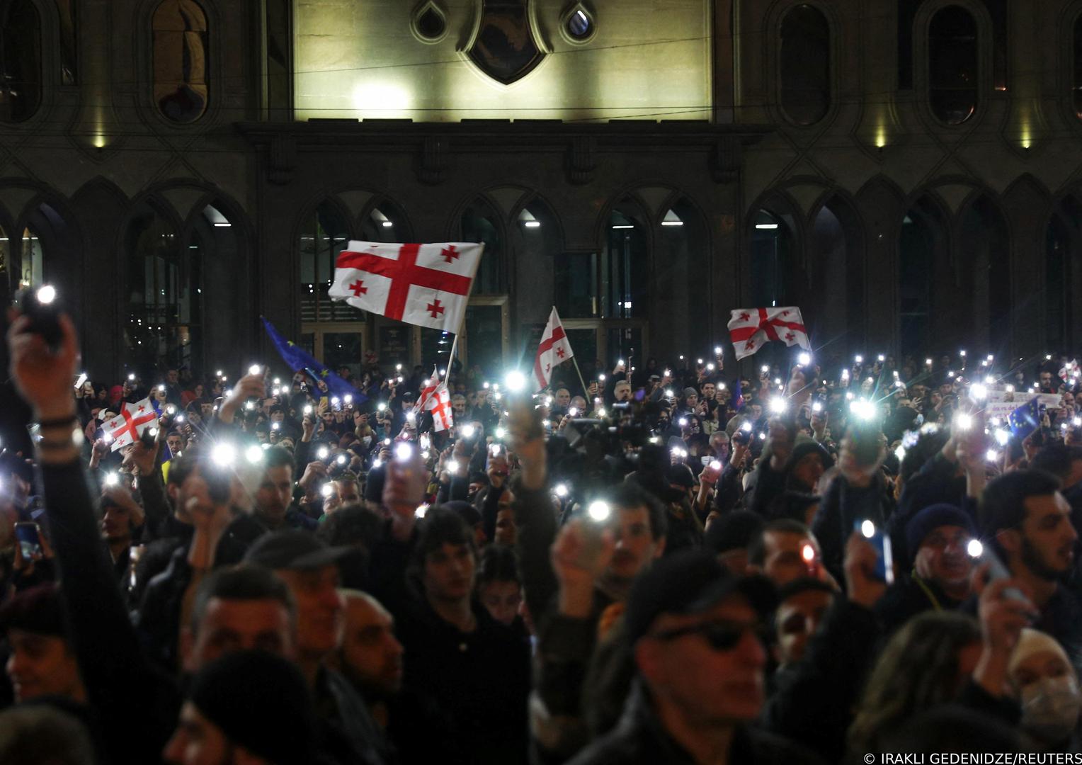 People take part in a protest demanding the government formally denounce the "foreign agents" bill, outside the parliament building in Tbilisi, Georgia March 9, 2023. REUTERS/Irakli Gedenidze Photo: IRAKLI GEDENIDZE/REUTERS