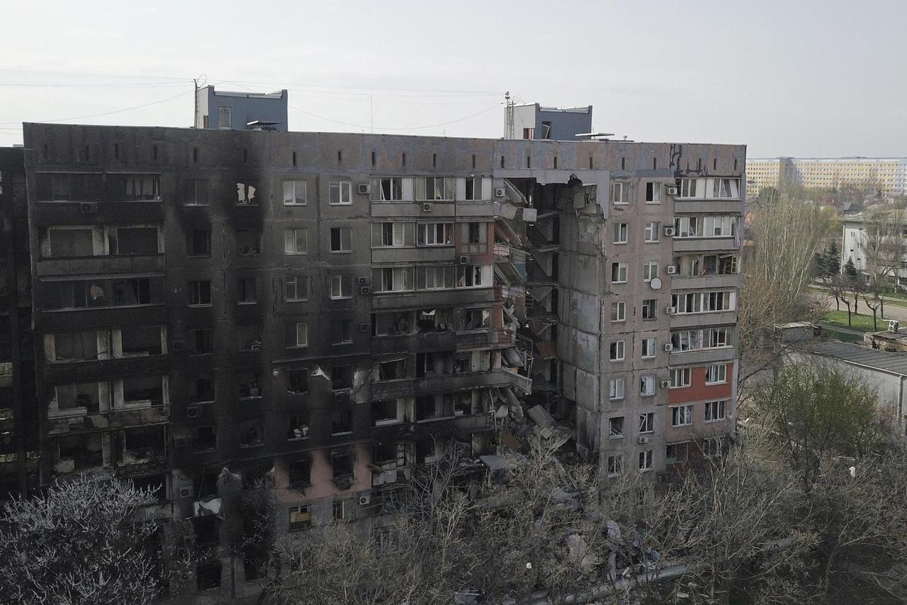 A view shows a damaged residential building in Mariupol