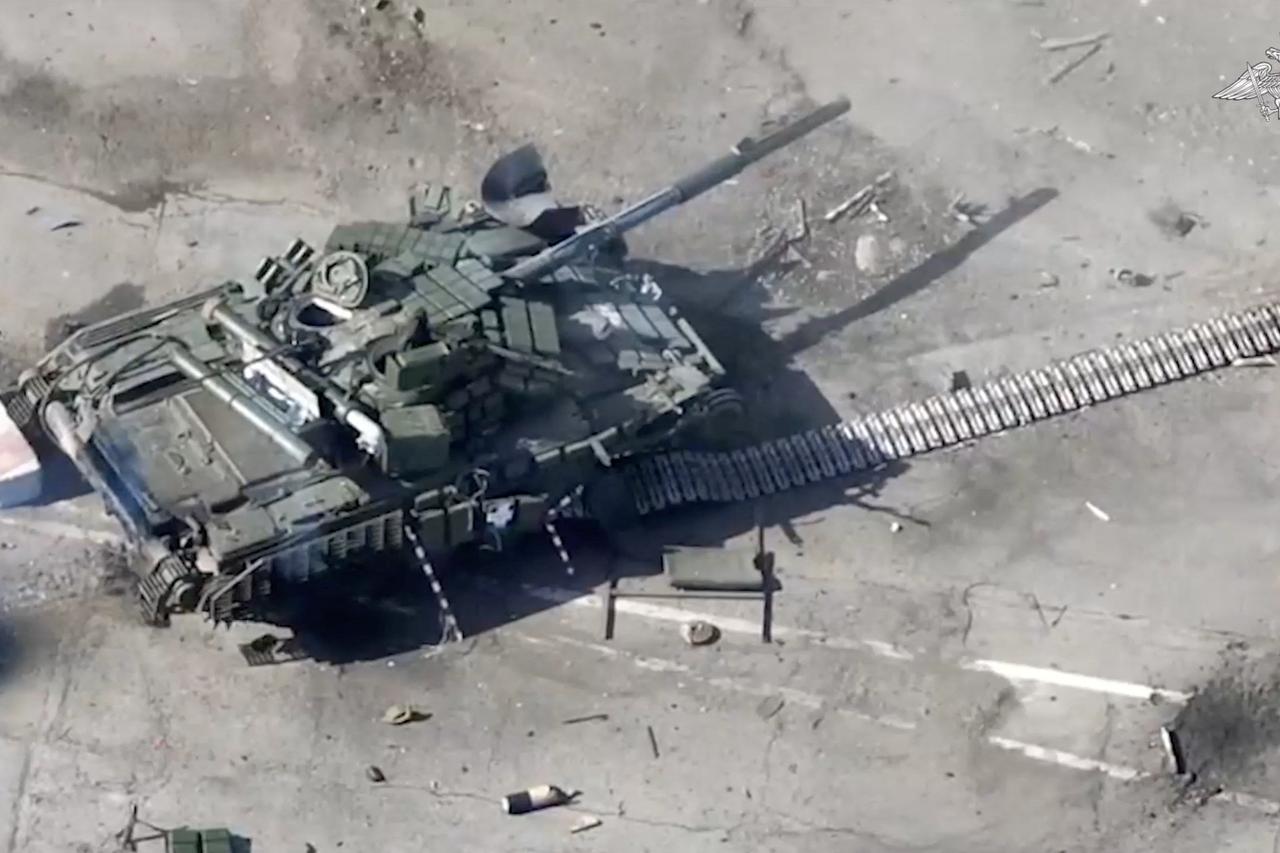 A view shows what Russian Defence Ministry says is a destroyed tank of Ukraine-based armed groups at a border crossing in Belgorod Region