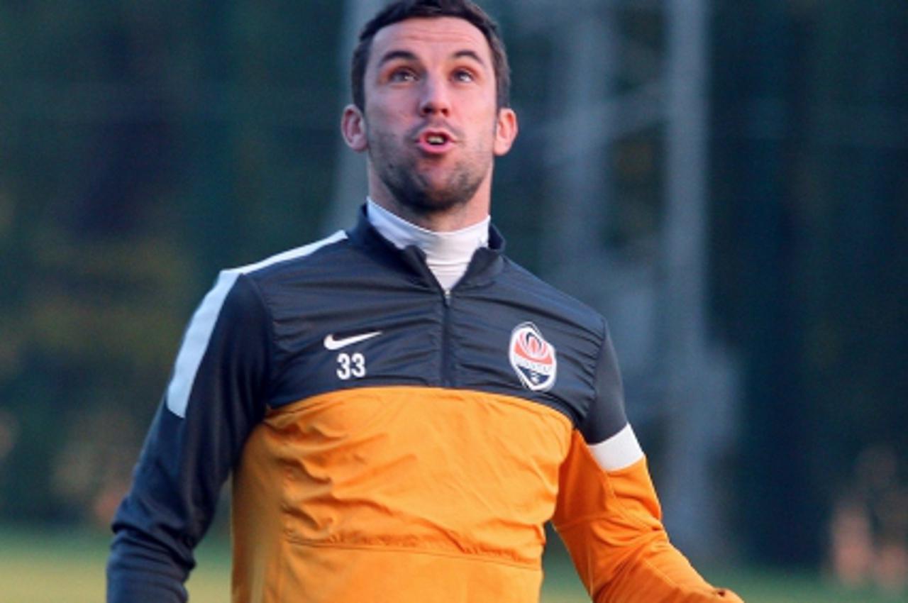 'Shakhtar FC captain Darijo Srna plays with a ball during a training session on the eve of the Group E UEFA Champions League football match between Shakhtar Donetsk and Chelsea, on October 22, 2012 in