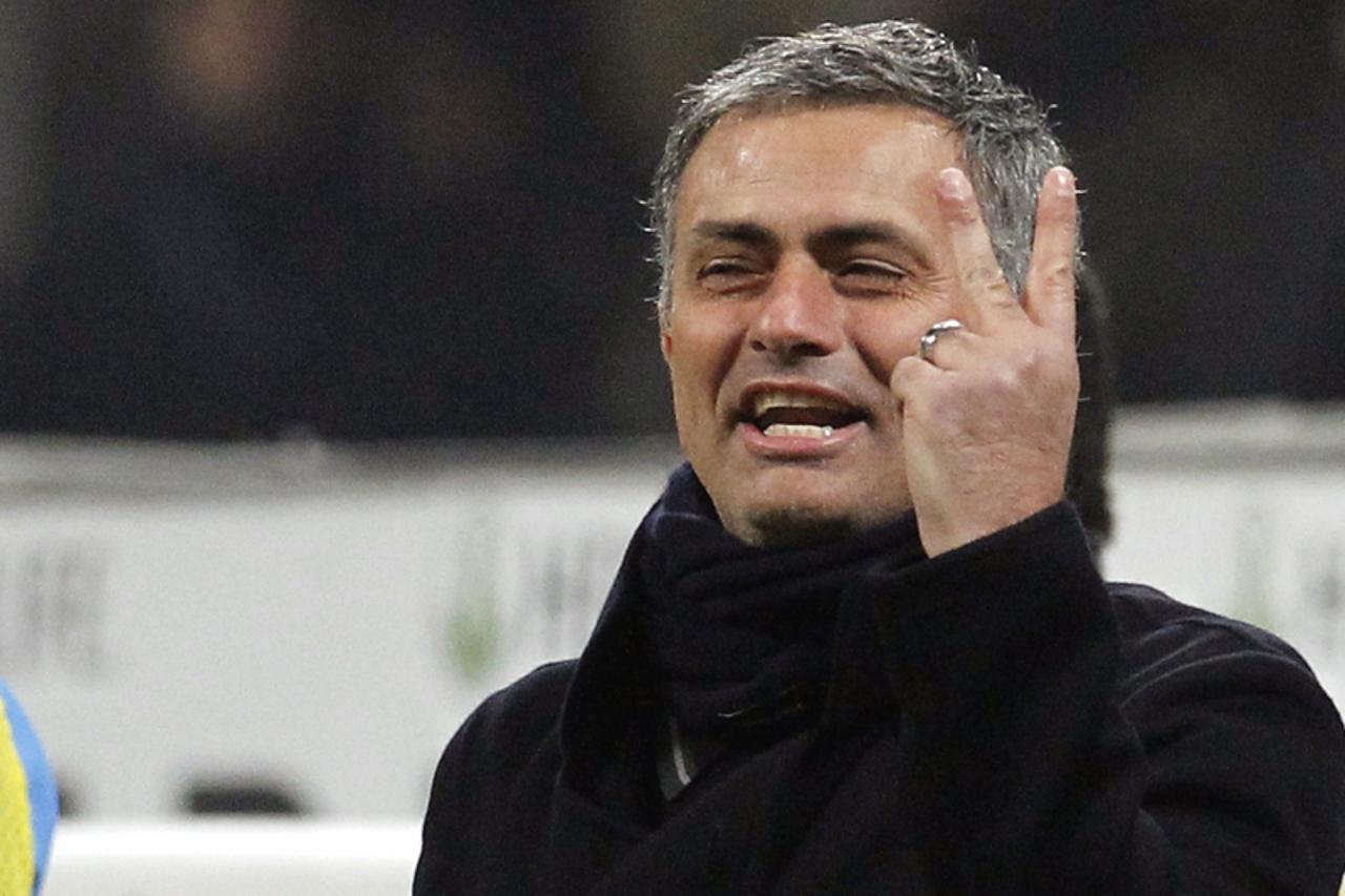 'Inter Milan\'s coach Jose Mourinho gestures during the Italian Serie A soccer match against AC Milan at the San Siro stadium in Milan January 24, 2010.  REUTERS/Alessandro Garofalo (ITALY - Tags: SPO