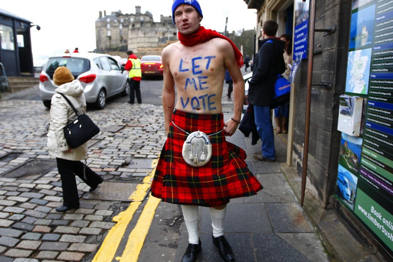 \'James Wallace wears a kilt as he stands outside the entrance to Edinburgh castle in Scotland January 25, 2012. Scotland\'s nationalist leader Alex Salmond marked Burns Night on Wednesday, when Scots