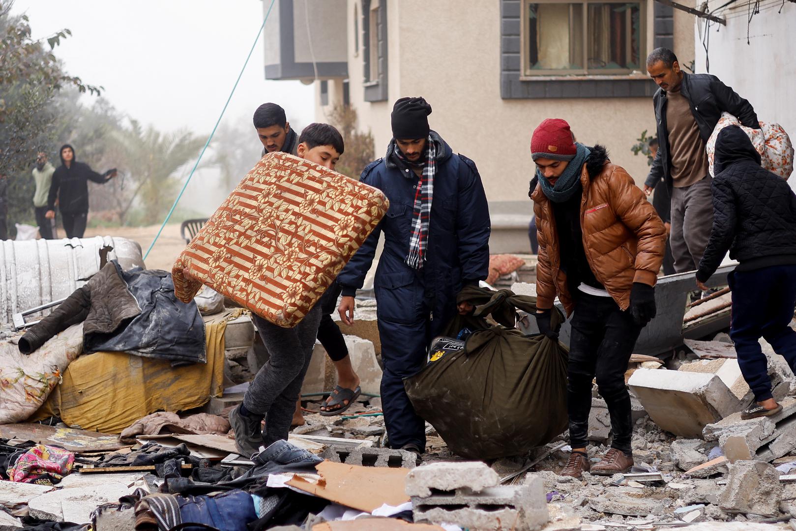 Palestinians carry belongings at the site of an Israeli strike on a house, amid the ongoing conflict between Israel and the Palestinian Islamist group Hamas, in Rafah in the southern Gaza Strip, February 9, 2024. REUTERS/Ibraheem Abu Mustafa Photo: IBRAHEEM ABU MUSTAFA/REUTERS