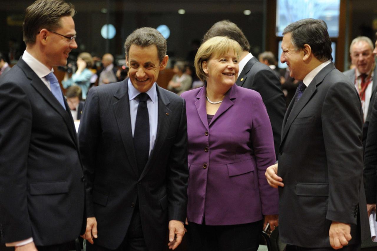 '(From L) Finland Prime Minister Jyrki Katainen, France President Nicolas Sarkozy, Germany Federal Chancellor Angela Merkel and European Commission President Jose Manuel Barroso speak before the start