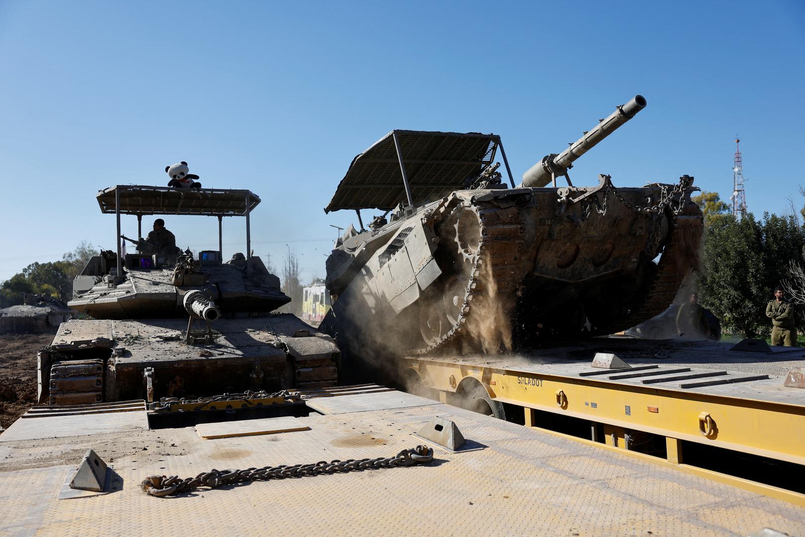 Israeli military tanks are loaded onto a carrier truck after returning from the Gaza strip, amid the ongoing conflict between Israel and Palestinian Islamist group Hamas, in southern Israel, February 29, 2024. REUTERS/Amir Cohen Photo: AMIR COHEN/REUTERS