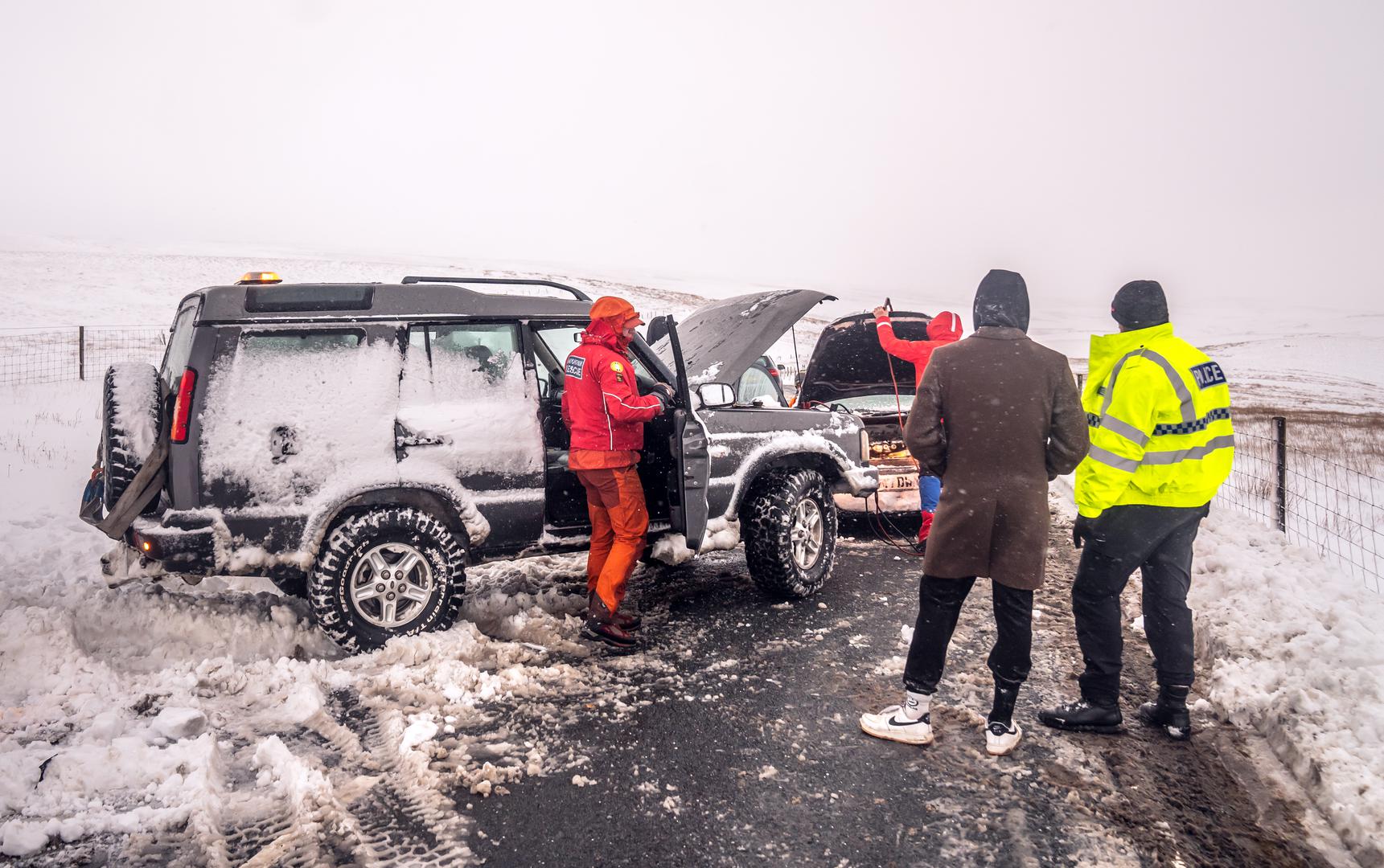 Members of a Mountain Rescue team after helping to clear cars from a snow drift near Ribblehead, in North Yorkshire. Large parts of the UK are facing heavy snow and freezing rain, which is likely to cause disruption, after two amber weather warnings came into force. Stranded vehicles on the roads, delayed or cancelled rail and air travel, and power cuts are all likely as the country grapples with a week-long spell of wintry conditions, the Met Office said. Picture date: Monday January 6, 2025. Photo: Danny Lawson/PRESS ASSOCIATION