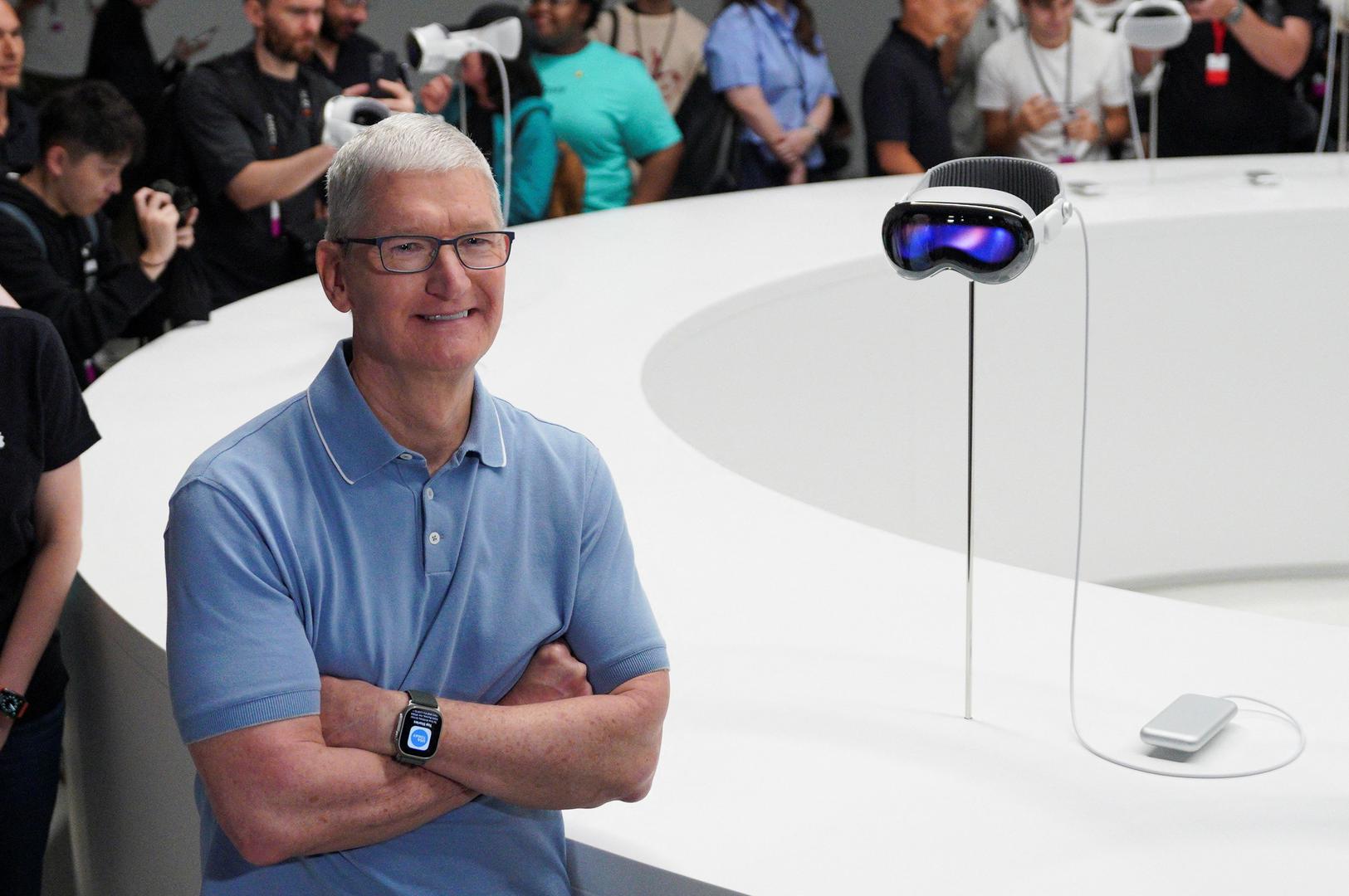 Apple CEO Tim Cook stands next to Apple's Vision Pro headset at Apple's annual Worldwide Developers Conference at the company's headquarters in Cupertino, California, U.S. June 5, 2023. REUTERS/Loren Elliott Photo: LOREN ELLIOTT/REUTERS