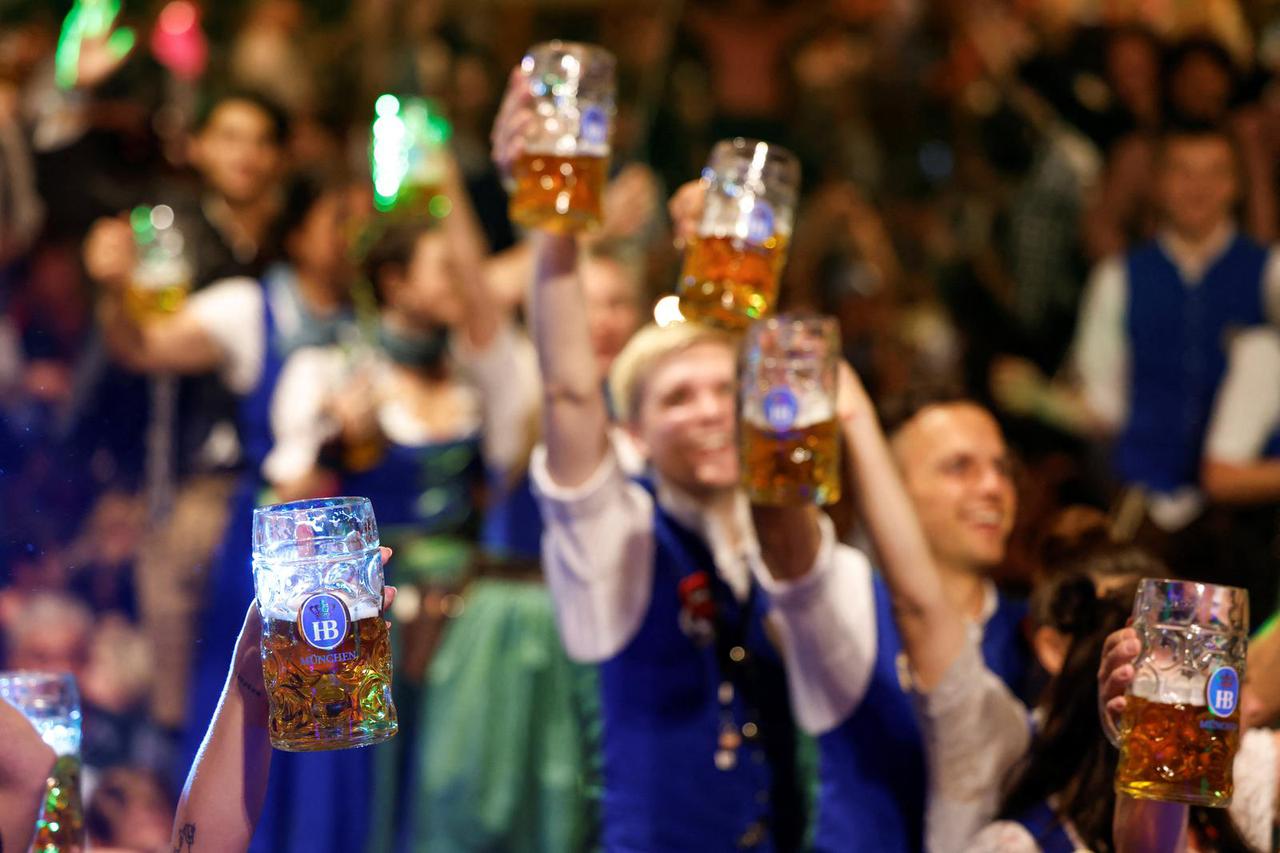 Oktoberfest waitresses toast with beer while they celebrate the end of the 189th Oktoberfest in Munich