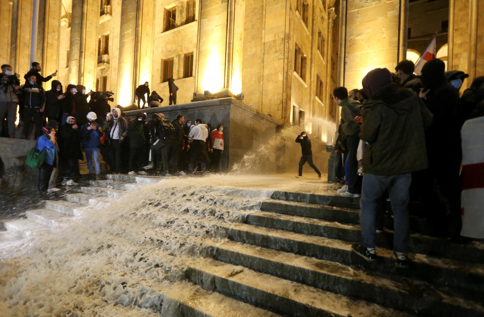 Police use water cannons to disperse protesters outside the parliament building during a rally against the "foreign agents" law in Tbilisi, Georgia, March 8, 2023. REUTERS/Irakli Gedenidze Photo: IRAKLI GEDENIDZE/REUTERS