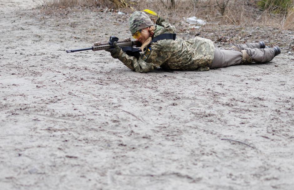 Alisa, a media relations specialist, takes part in a combat skills training conducted by the Territorial Defense Forces near Kyiv