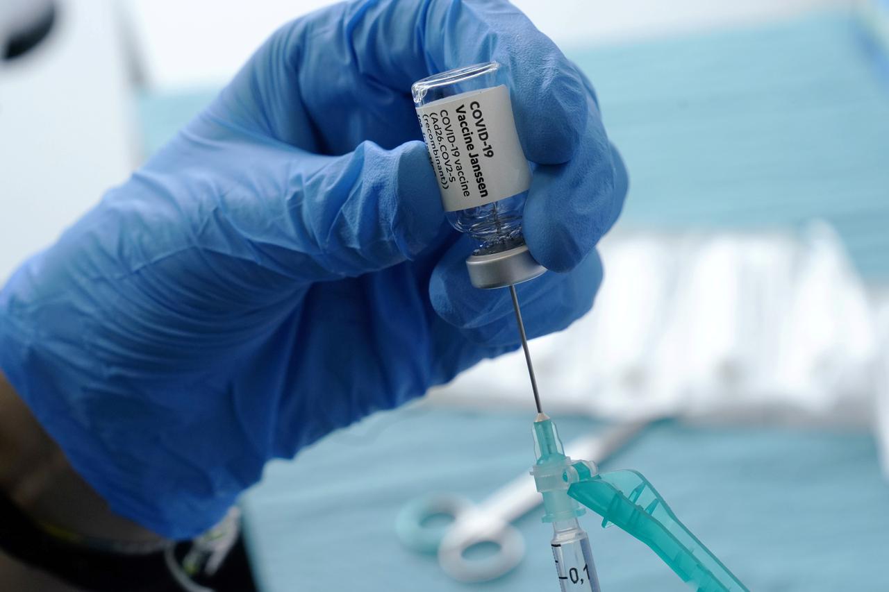 A health worker prepares a Johnson & Johnson's COVID-19 vaccine at the Forem vaccination centre in Pamplona