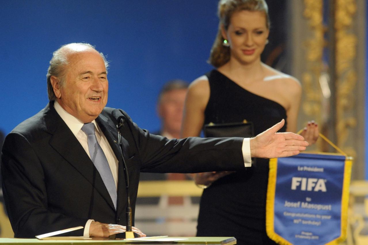 'FIFA President Sepp Blatter gestures on the stage during the Czech Republic\'s Football Player of the Year 2010 award ceremony on February 7, 2011 in Prague as he congratulates Czech legendary midfie