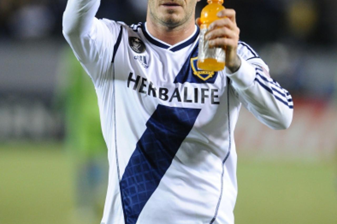 'David Beckham waives to the fans after Leg One of the Western Conference Championship at The Home Depot Center in Los Angeles, California, November 11, 2012. The Galaxy won 3-0. Photo by Lionel Hahn/