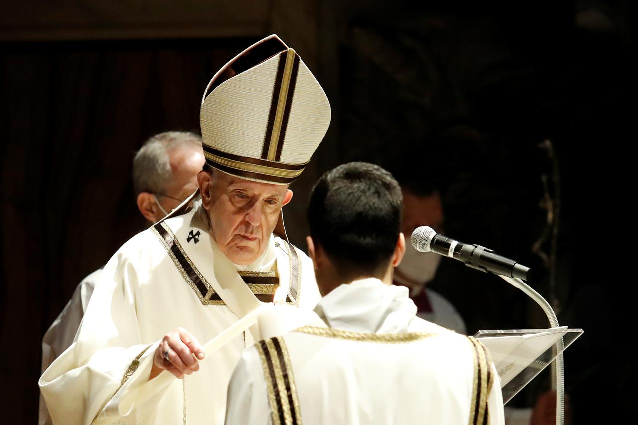 Pope Francis celebrates the Easter Vigil in a near empty St. Peter's Basilica, at the Vatican