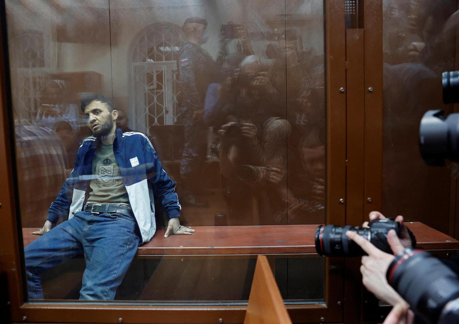 Dalerdzhon Mirzoyev, a suspect in the shooting attack at the Crocus City Hall concert venue, sits behind a glass wall of an enclosure for defendants at the Basmanny district court in Moscow, Russia March 24, 2024. REUTERS/Yulia Morozova Photo: YULIA MOROZOVA/REUTERS