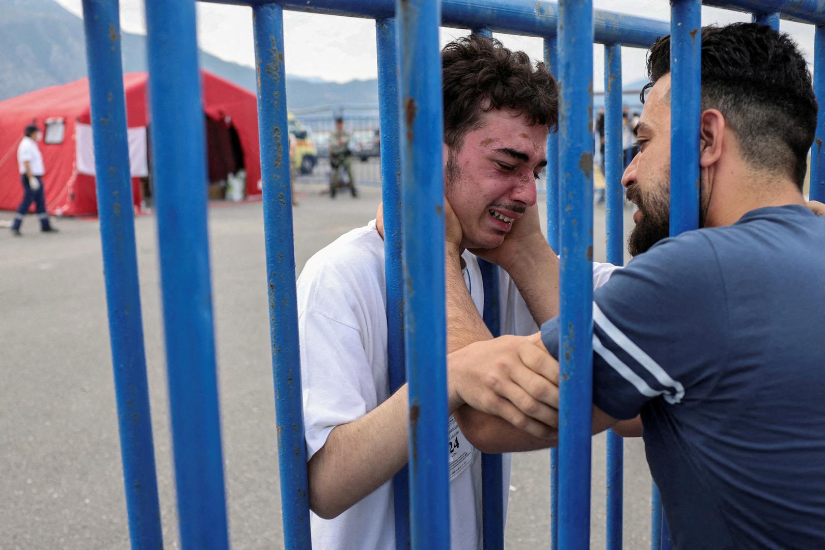 Syrian survivor Mohammad, 18, who was rescued with other refugees and migrants at open sea off Greece after their boat capsized, cries as he reunites with his brother Fadi, who came to meet him from Netherlands, at the port of Kalamata, Greece, June 16, 2023. REUTERS/Stelios Misinas     TPX IMAGES OF THE DAY      REFILE - CORRECTING IDs Photo: STELIOS MISINAS/REUTERS