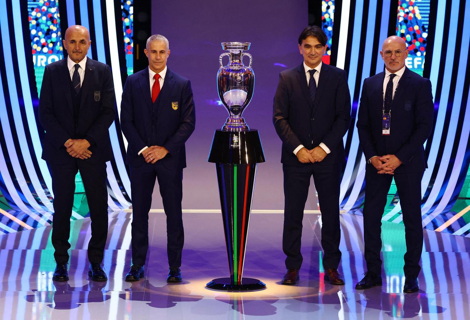 Soccer Football - UEFA Euro 2024 Final Draw - Elbphilharmonie Hamburg, Hamburg, Germany - December 2, 2023 Italy coach Luciano Spalletti, Croatia coach Zlatko Dalic, Spain coach Luis de la Fuente and Albania coach Sylvinho pose with the trophy after the draw REUTERS/Kai Pfaffenbach Photo: Kai Pfaffenbach/REUTERS