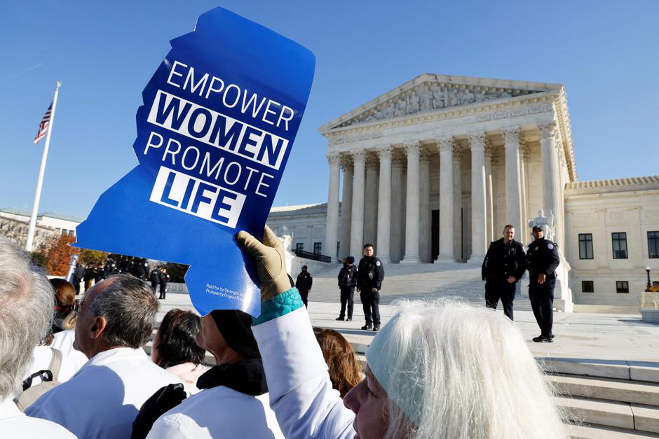 Anti-abortion and pro-abortion rights protesters gather outside Supreme Court in Washington