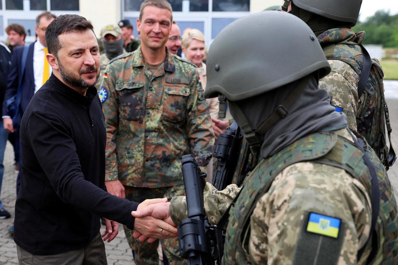 FILE PHOTO: A Ukrainian serviceman patrols in the town of Sudzha