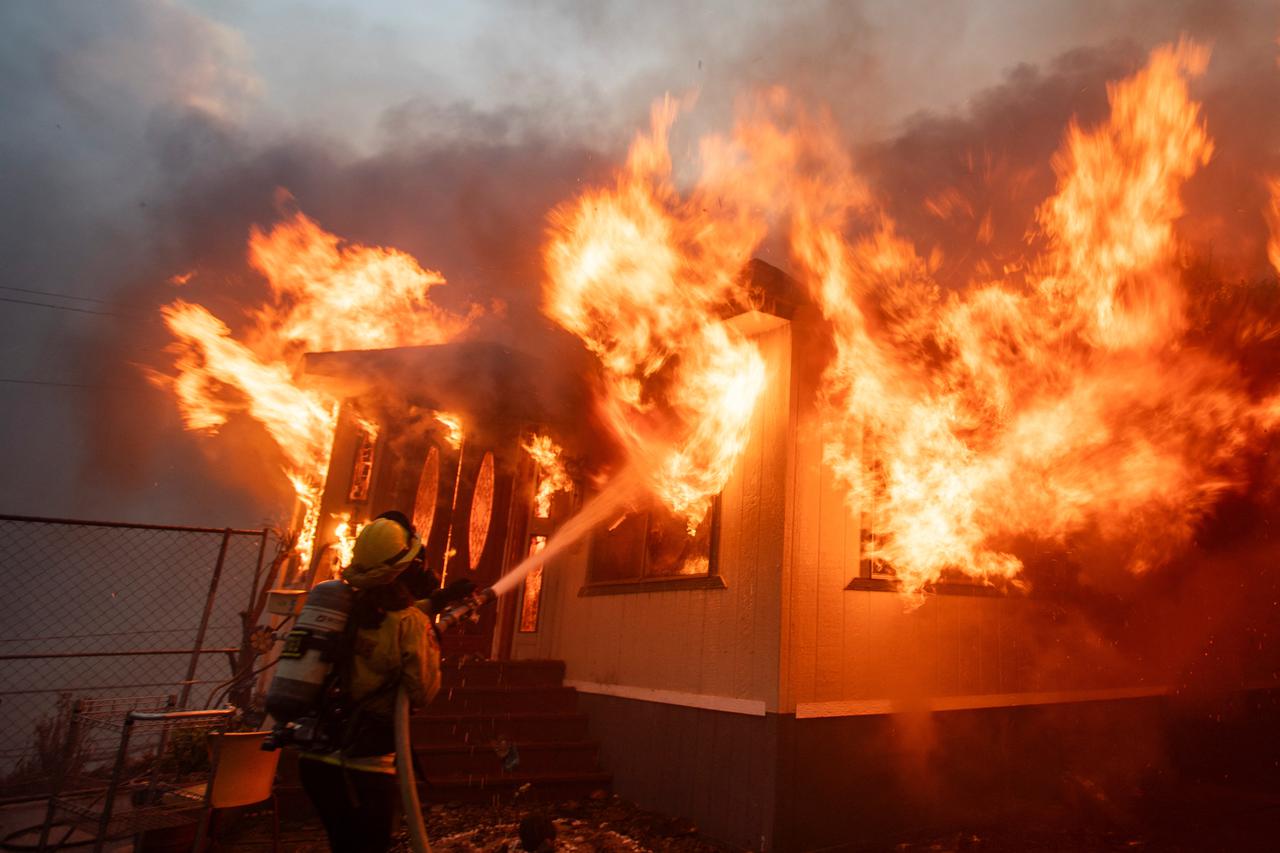 Palisades Fire burns during a windstorm on the west side of Los Angeles