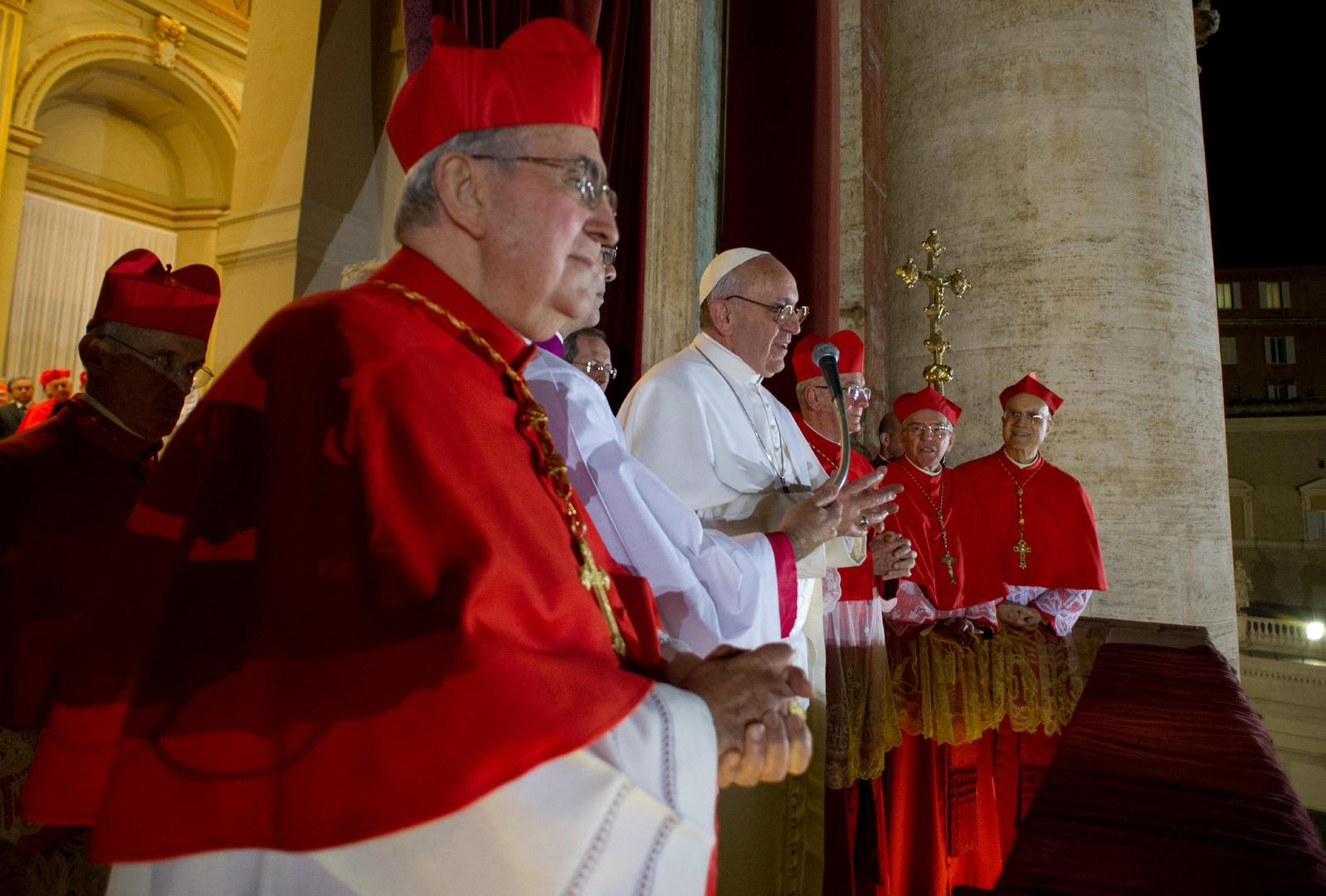 FILE PHOTO: Newly elected Pope Francis I (C), Cardinal Jorge Mario Bergoglio of Argentina appears on the balcony of St. Peter's Basilica after being elected by the conclave of cardinals, in a photograph released by Osservatore Romano at the Vatican, March 13, 2013. White smoke rose from the Sistine Chapel chimney and the bells of St. Peter's Basilica rang out on Wednesday, signaling that Roman Catholic cardinals had elected a pope to succeed Benedict XVI. REUTERS/Osservatore Romano Vatican Media/­Handout via REUTERS  ATTENTION EDITORS - THIS IMAGE WAS PROVIDED BY A THIRD PARTY. /File Photo  SEARCH "10TH ANNIVERSARY POPE FRANCIS' PAPACY" FOR THE PHOTO Photo: VATICAN MEDIA/REUTERS