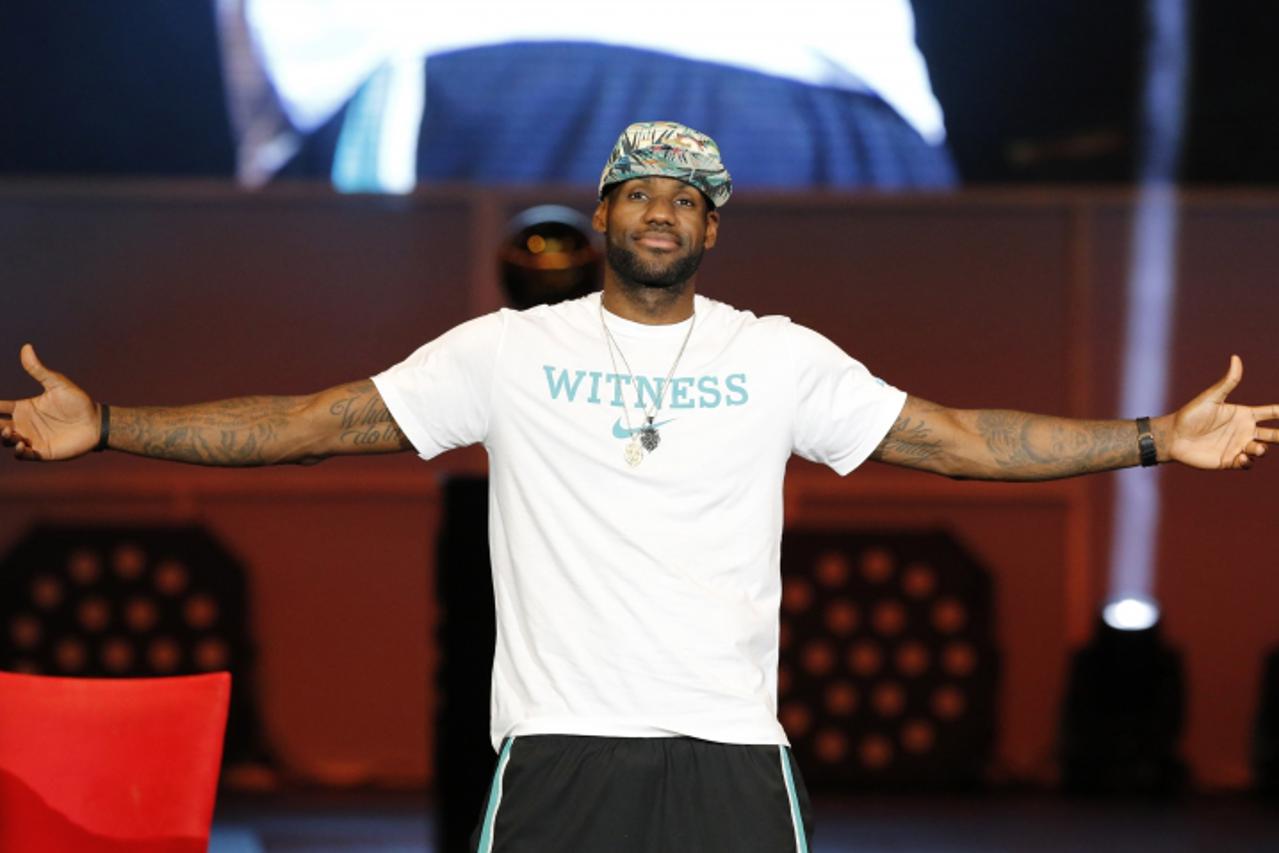 'Miami Heat player LeBron James reacts during a celebration of the Heat\'s 2013 NBA basketball championship at the American Airlines Arena in Miami, Florida June 24, 2013.  REUTERS/Joe Skipper   (UNIT