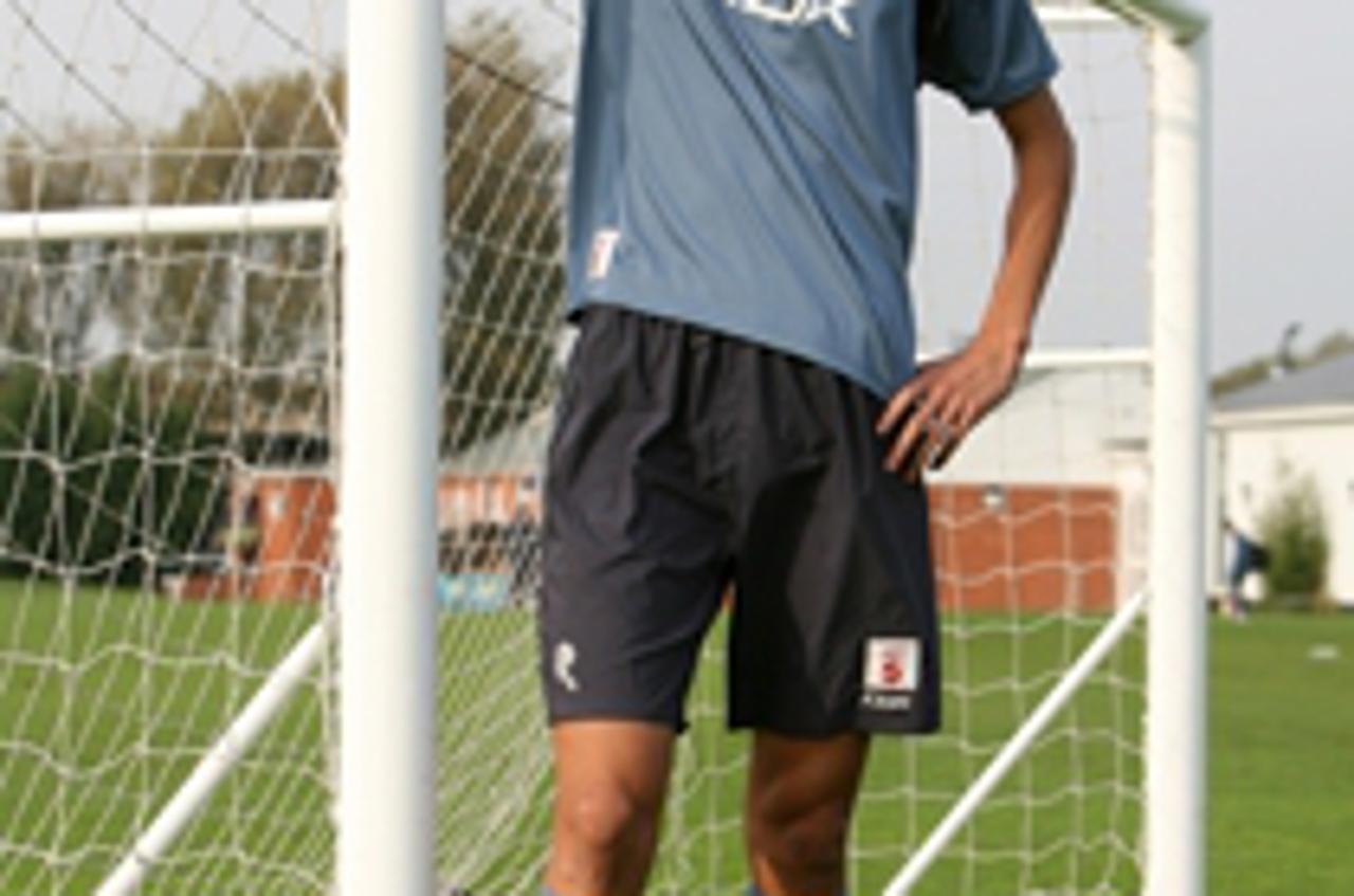 'Chinese youth international footballer Yang Changpeng leans on a practice goal at Bolton\'s  training ground near Bolton England Tuesday Oct. 17, 2006 . Yang is one of two players from the Chinese si