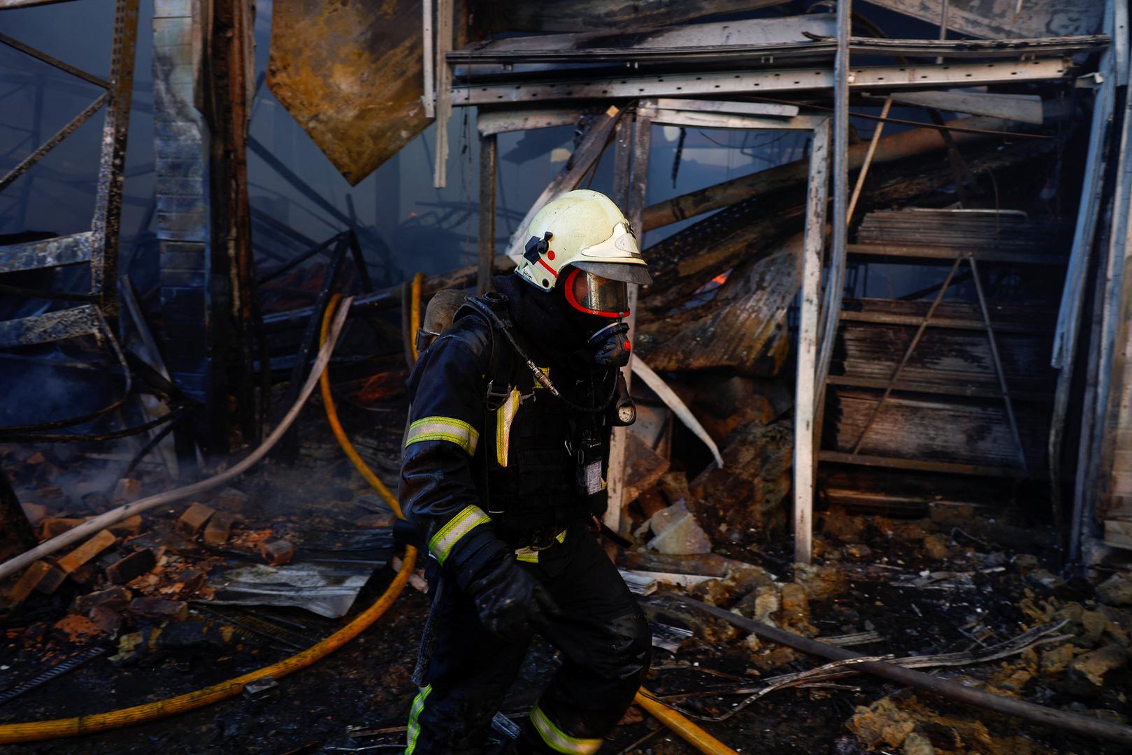 A firefighter works at the site of a household item shopping mall which was hit by a Russian air strike, amid Russia's attack on Ukraine, in Kharkiv, Ukraine, May 25, 2024. REUTERS/Valentyn Ogirenko Photo: VALENTYN OGIRENKO/REUTERS