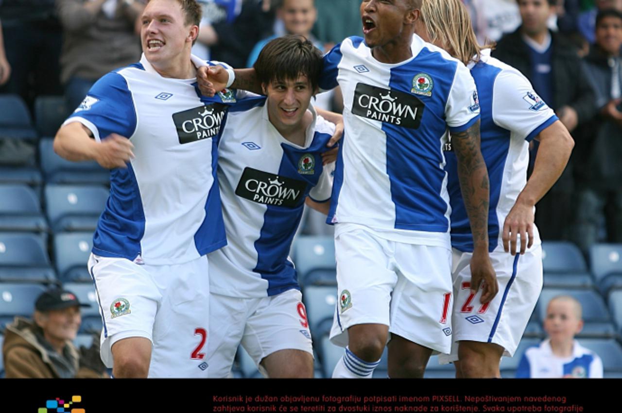 'Blackburn Rovers\' Nikola Kalinic (centre) celebrates with team mates El-Hadji Diouf (right) and Phil Jones (left) after scoring the opening goal. Photo: Press Association/Pixsell'