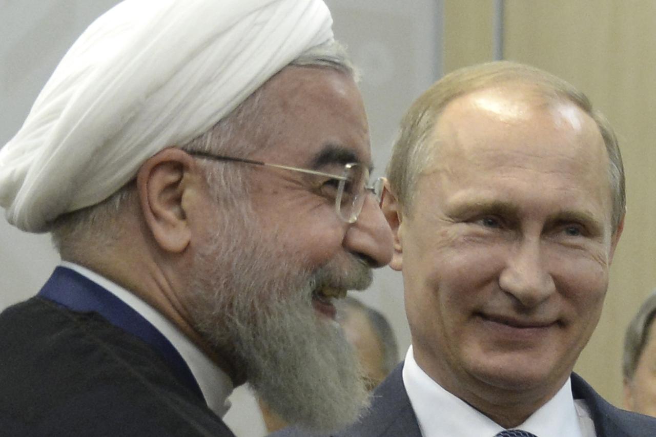 Russian President Vladimir Putin (R) meets with Iran's President Hassan Rouhani in Ufa, Russia, July 9, 2015. Rouhani said on Thursday he was grateful to Russia for its efforts to secure an agreement at talks between six major powers and Iran on Tehran's 