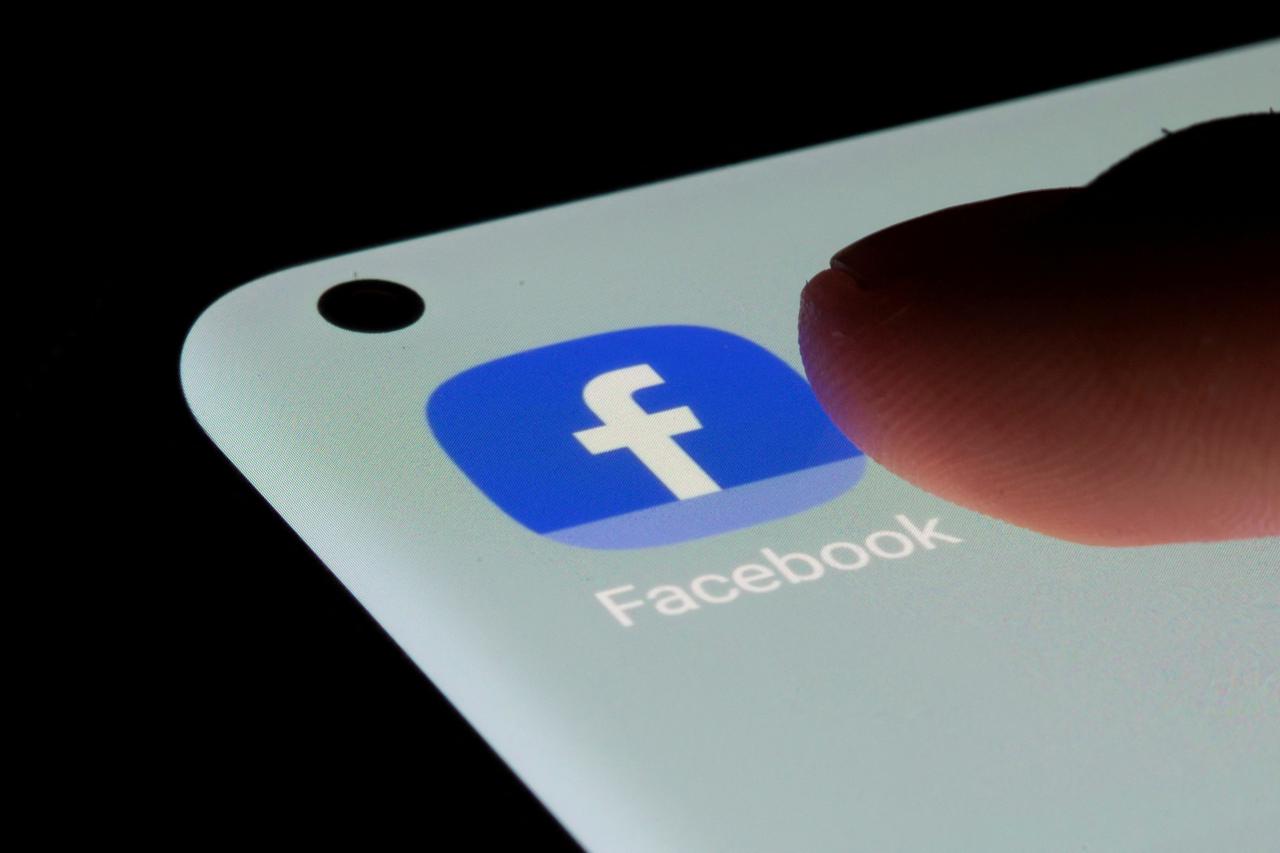 FILE PHOTO: Facebook app is seen on a smartphone in this illustration