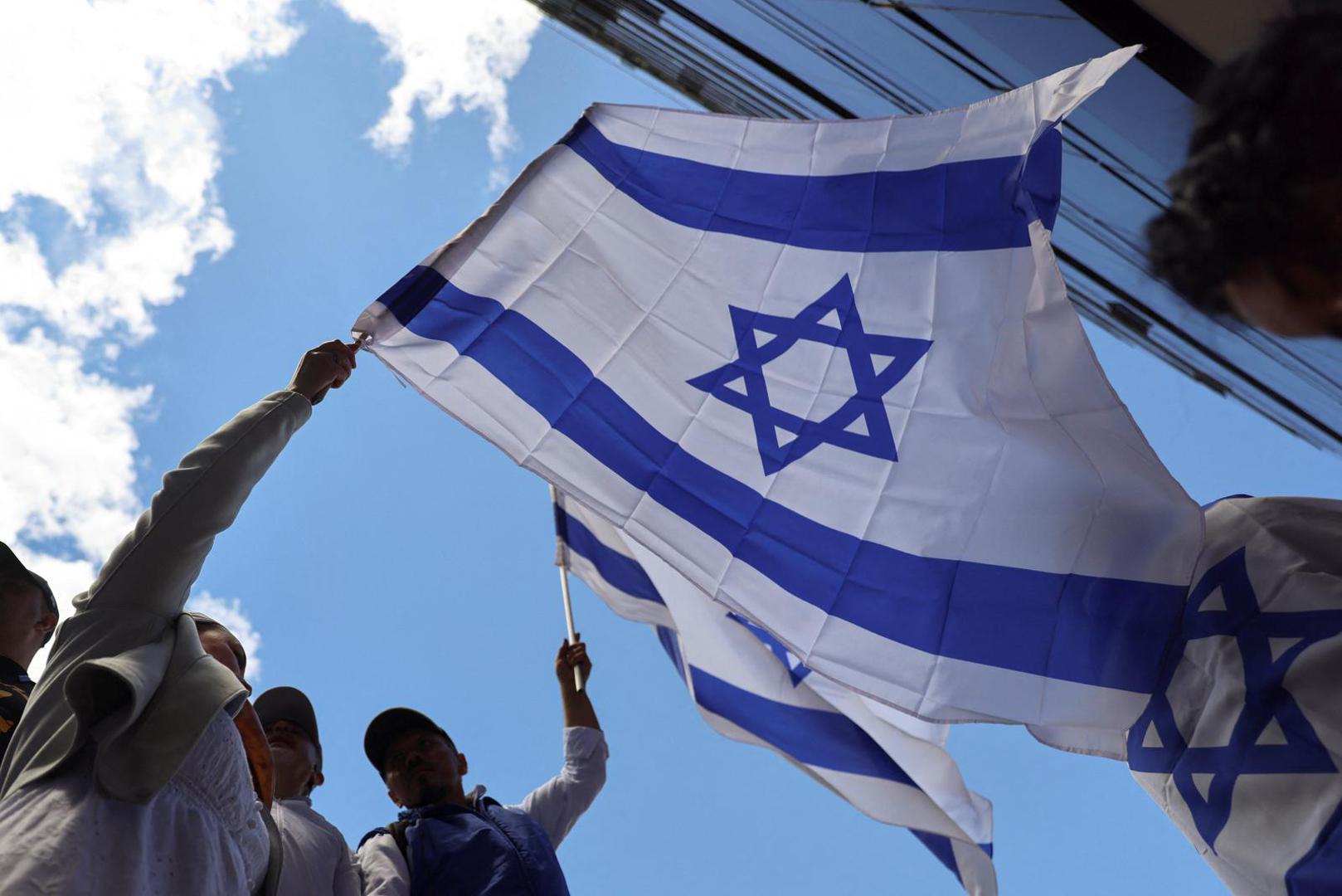 Israel supporters hold flags as they protest, following Hamas' biggest attack on Israel in years, in Bogota, Colombia October 9, 2023. REUTERS/Luisa Gonzalez Photo: LUISA GONZALEZ/REUTERS