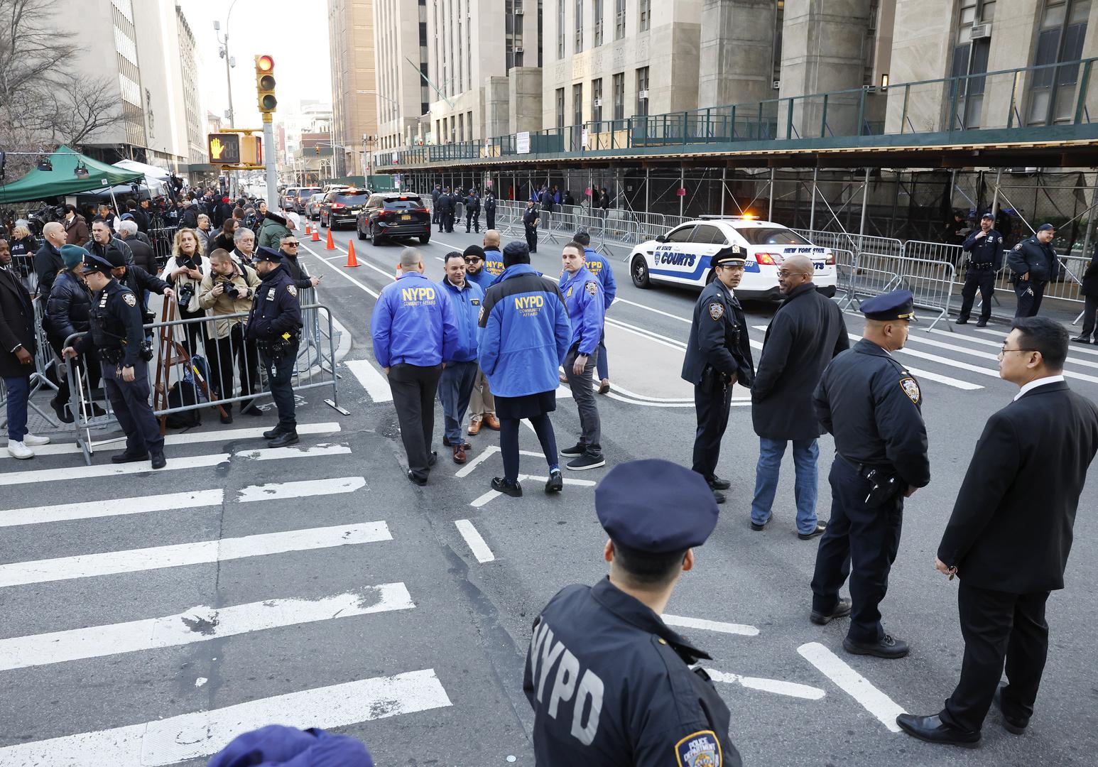 Media stand behind police barricades outside New York Criminal Court at 100 Centre Street awaiting the arrival and the arraignment of Former President Donald Trump after a grand jury indictment in New York City on Tuesday, April 4, 2023. Donald Trump was indicted Thursday by a Manhattan grand jury on more than 30 counts related to business fraud. Manhattan District Attorney Alvin Bragg has been investigating the former president in connection with his alleged role in a hush money payment scheme and cover-up involving adult film star Stormy Daniels. Photo by John Angelillo/UPI Photo via Newscom Photo: John Angelillo/NEWSCOM