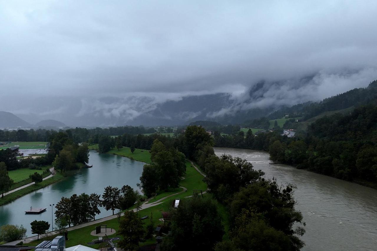 The Salzach river flows past the village of Kuchl near Salzburg