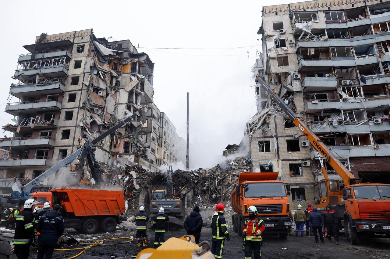 Aftermath of Dnipro apartment block destruction following missile strike