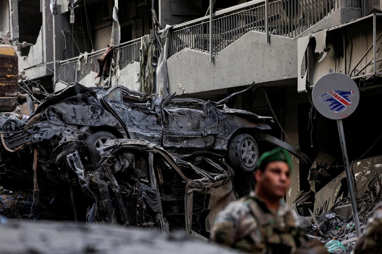 A Lebanese army soldier stands guard at the site of an Israeli strike in Beirut