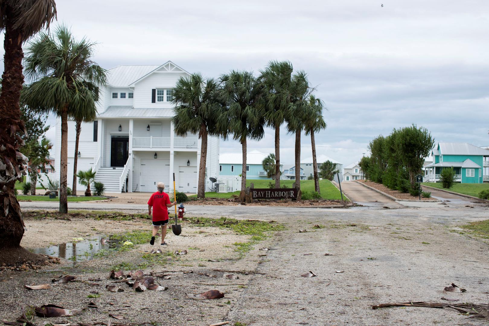 Marguerite Cruti clears debris from culverts to allow standing water to flow after Hurricane Beryl moved through the area in Matagorda, Texas, U.S. July 8, 2024.  REUTERS/Kaylee Greenlee Beal Photo: KAYLEE GREENLEE BEAL/REUTERS