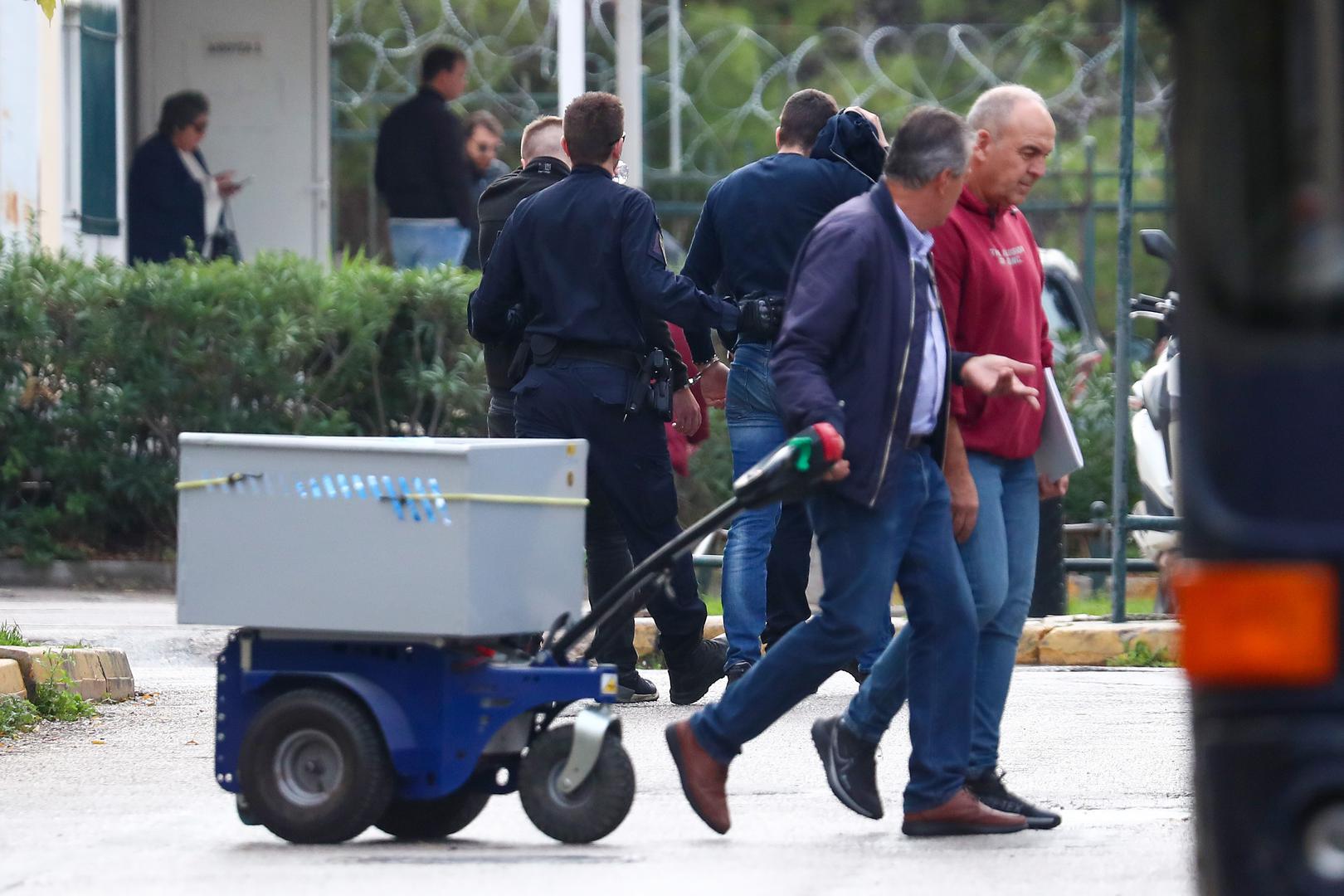 06.12.2023., Atena, Grcka - Policija dovodi na sud navijace Dinama, Bad Blue Boyse. Photo: Matija Habljak/PIXSELL