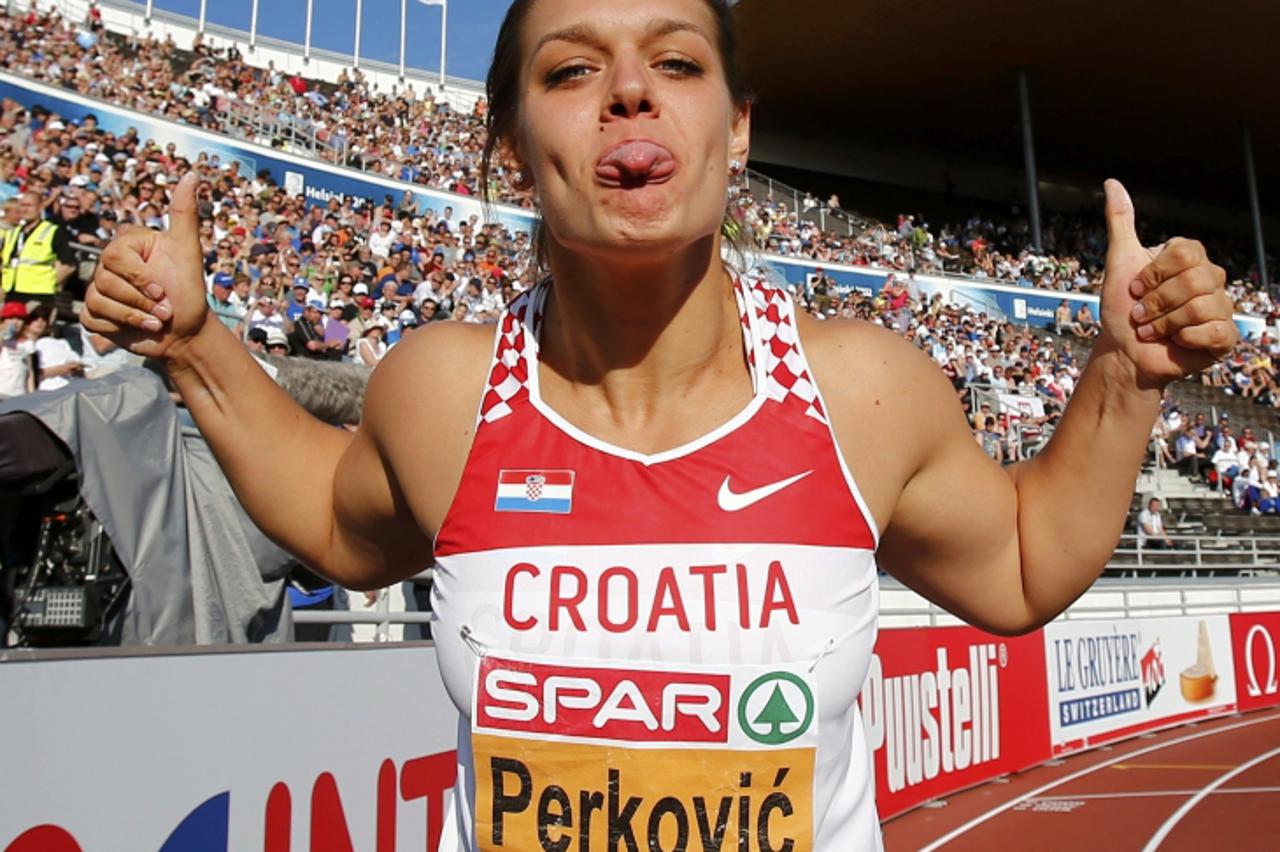 'Sandra Perkovic of Croatia poses after winning the women\'s discus final at the European Athletics Championships in Helsinki July 1, 2012.    REUTERS/Dominic Ebenbichler (FINLAND  - Tags: SPORT ATHLE