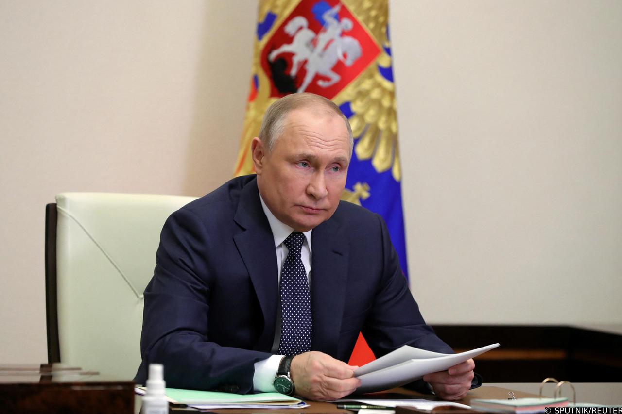 Russian President Vladimir Putin chairs a meeting outside Moscow