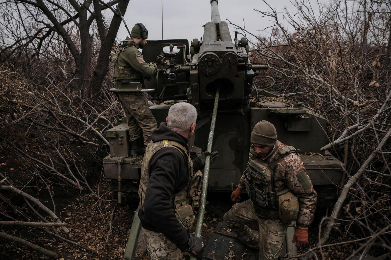 Ukrainian servicemen fire a self-propelled howitzer towards Russian troops at a front line near the town of Chasiv Yar