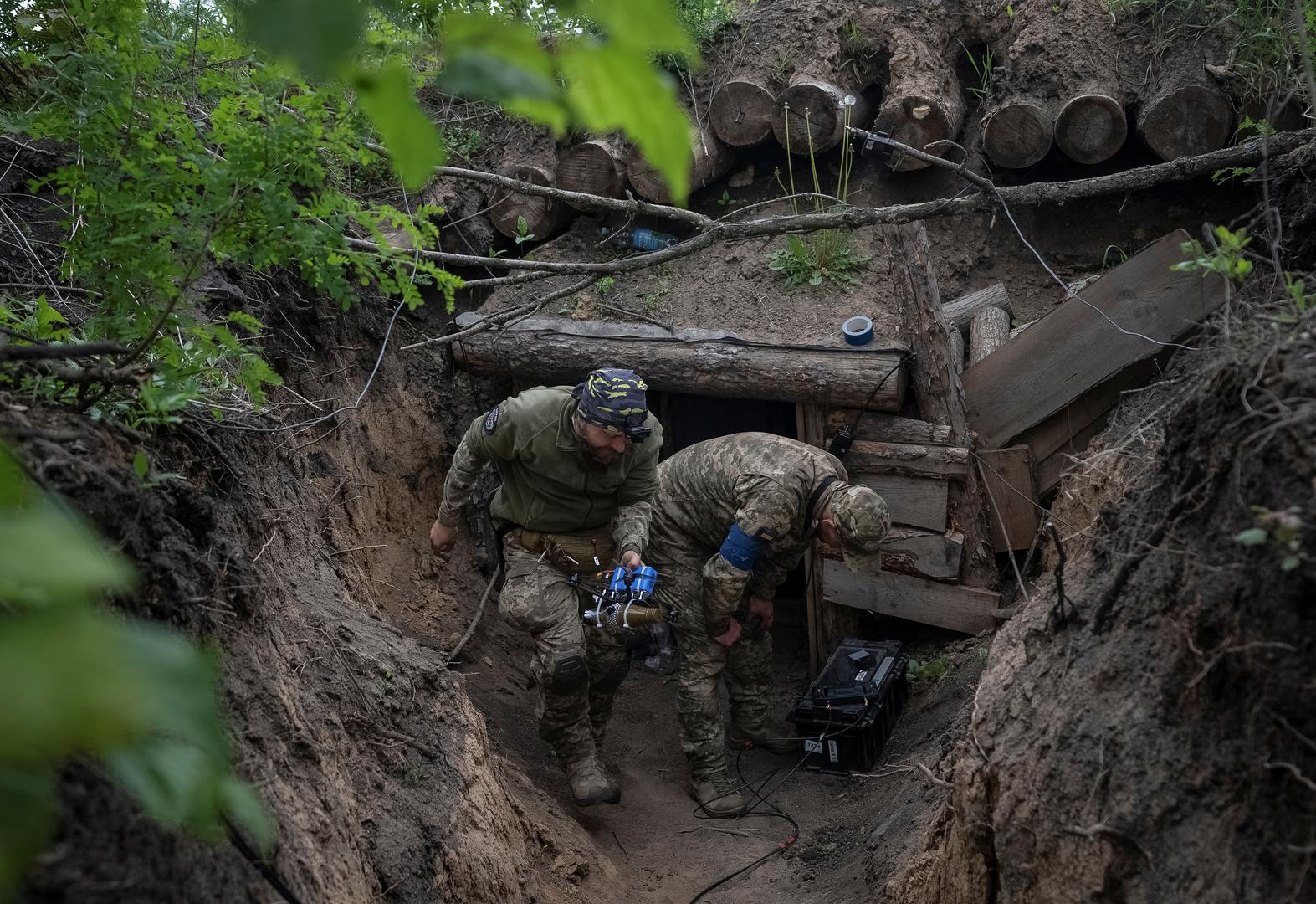 A Ukrainian serviceman of the attack drones battalion of the Achilles, 92nd brigade carries a first-person view (FPV) drone before it flies, near a Russian border in a Kharkiv region, Ukraine May 15, 2024. REUTERS/Inna Varenytsia Photo: Inna Varenytsia/REUTERS