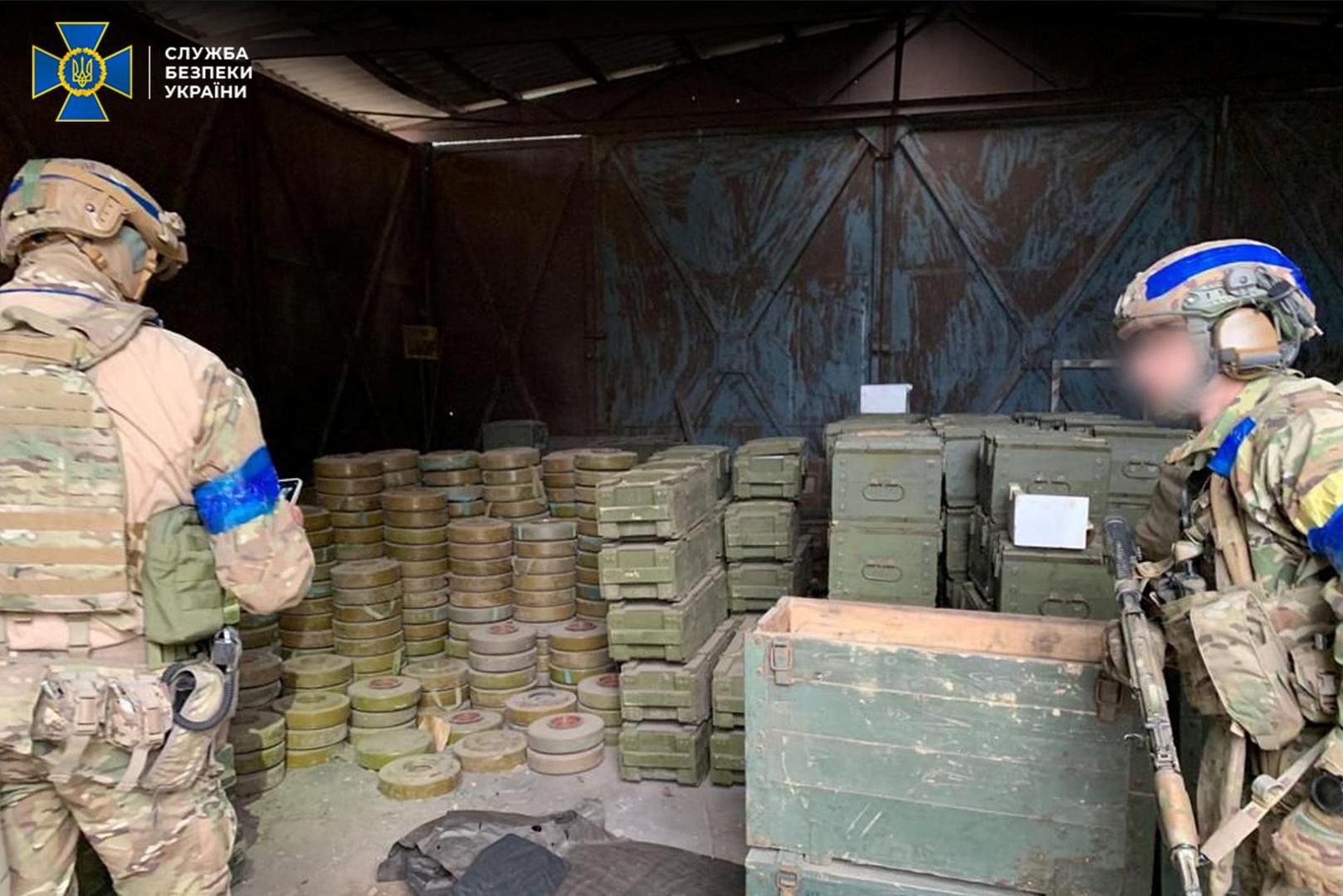 Service members of the State Security Service of Ukraine inspect ammo and shells left by Russian soldiers in the recently liberated town of Izium, amid Russia's attack on Ukraine, in Kharkiv region, Ukraine, in this handout picture released September 12, 2022. Press Service of the State Security Service of Ukraine/Handout via REUTERS ATTENTION EDITORS - THIS IMAGE HAS BEEN SUPPLIED BY A THIRD PARTY. DO NOT OBSCURE LOGO. PART OF THE IMAGE HAS BEEN BLURRED AT SOURCE. Photo: STATE SECURITY SERVICE OF UKRAIN/REUTERS